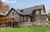 exterior of large home with wooden balconies