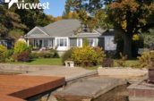 exterior of home with new roof and wooden dock