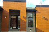exterior of angular modern home with new siding