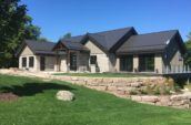 exterior of home with new roof and landscaping