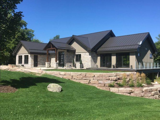 exterior of home with new roof and landscaping