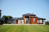 exterior of home with new roof and large lawn