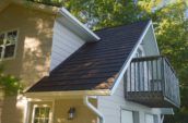 exterior of home with new roof and small balcony