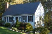 exterior of small home with new navy roof