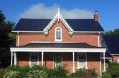 exterior of home with new dark metal roofing