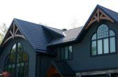 exterior of dark home with new metal roofing