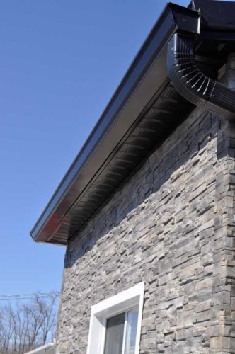 black eavestroughs on exterior of home