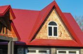 close up of red tile shingles on roof