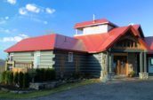 exterior of home with red tile shingles on roof